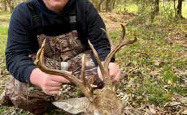 Myles Hall is shown with the deer nicknamed, “Medusa,” that he harvested during a recent deer camp. Photos provided