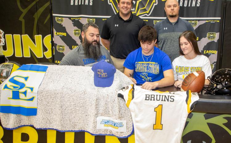 Caddo Bruin Coltin Speers signed to play football with Southeastern. He is shown with his stepfather Justin Fite, mother Chelsea Fite, head Caddo Football coach Trenton Harmon and assistant coach Brandon Bookout.